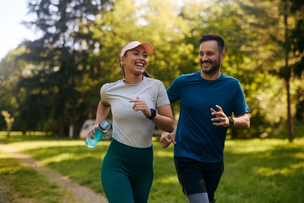 Young man running with a woman for exercise to treat Low T in Los Angeles, CA